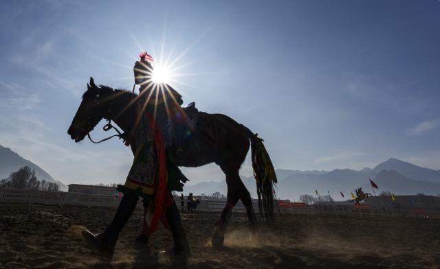 (260220) -- LHASA, Feb. 20, 2026 (Xinhua) -- A equestrian performer warms up before the performances in Lhasa, southwest China's Xizang Autonomous Region, Feb. 20, 2026. Monday was the Chinese New Year's Eve, which was just one day earlier than the Night of Gutu of the Tibetan calendar this year, the prelude to the Tibetan New Year, or Losar, the most important festival in the Tibetan calendar.
    Losar is a time for family reunions. It is marked by religious rituals, long prayers, horse racing, family gatherings and feasts. 
    The city of Lhasa hosted ethnic equestrian performances and horse racing on Friday, the fourth day of the Year of the Horse, and also the third day of the Tibetan New Year, showcasing superb traditional skills and offering visual enjoyment to the audience. (Xinhua/Tenzin Nyida)