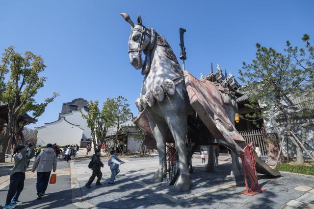 (260220) -- BEIJING, Feb. 20, 2026 (Xinhua) -- This photo shows a giant horse statue at the Puyuan Fashion Resort in Tongxiang City of Jiaxing, east China's Zhejiang Province, Feb. 20, 2026. China's Ministry of Culture and Tourism launched a month-long cultural and tourism campaign ahead of the Spring Festival, featuring a wide range of activities and promotional measures to better meet people's needs.
   Running from late January to early March, the campaign will see about 30,000 activities held nationwide, offering seasonal cultural and tourism products and events focused on traditional New Year customs, performances, and exhibitions.
   More than 360 million yuan (about 51.6 million U.S. dollars) in consumption vouchers and subsidies will be distributed, alongside measures such as ticket discounts, bundled ticket incentives, and cross-regional tourism promotions. (Xinhua/Xu Yu)