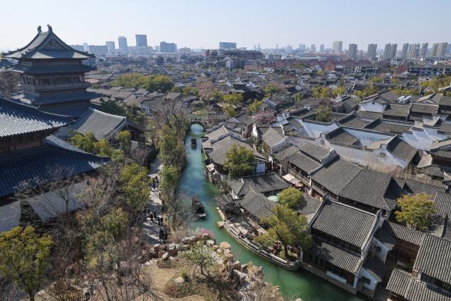 (260220) -- BEIJING, Feb. 20, 2026 (Xinhua) -- This photo taken on Feb. 20, 2026 shows a view of the Puyuan Fashion Resort in Tongxiang City of Jiaxing, east China's Zhejiang Province. China's Ministry of Culture and Tourism launched a month-long cultural and tourism campaign ahead of the Spring Festival, featuring a wide range of activities and promotional measures to better meet people's needs.
   Running from late January to early March, the campaign will see about 30,000 activities held nationwide, offering seasonal cultural and tourism products and events focused on traditional New Year customs, performances, and exhibitions.
   More than 360 million yuan (about 51.6 million U.S. dollars) in consumption vouchers and subsidies will be distributed, alongside measures such as ticket discounts, bundled ticket incentives, and cross-regional tourism promotions. (Xinhua/Xu Yu)