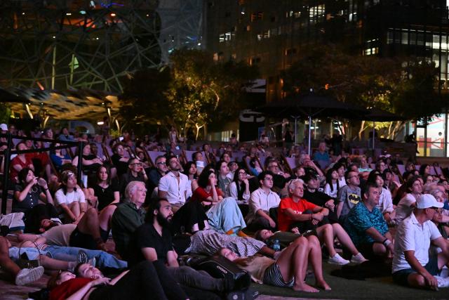 (260220) -- MELBOURNE, Feb. 20, 2026 (Xinhua) -- Audiences watch The Goddess, the 1934 classic Chinese silent movie, at the Federation Square in Melbourne, Australia, on Feb. 20, 2026. This is the last silent movie shown here from Feb. 16 to 20. (Xinhua/Xu Haijing)