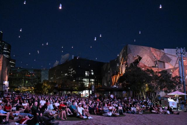 (260220) -- MELBOURNE, Feb. 20, 2026 (Xinhua) -- Audiences watch The Goddess, the 1934 classic Chinese silent movie, at the Federation Square in Melbourne, Australia, on Feb. 20, 2026. This is the last silent movie shown here from Feb. 16 to 20. (Xinhua/Xu Haijing)