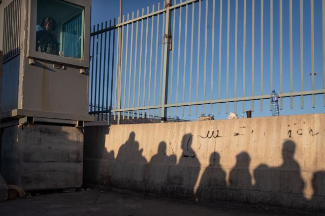(260220) -- JERUSALEM, Feb. 20, 2026 (Xinhua) -- West Bank residents queue for security checks at the Qalandiya checkpoint, north of Jerusalem, Feb. 20, 2026. Israeli authorities tightened security in Jerusalem on the first Friday of Ramadan, capping West Bank worshippers' access to the Al-Aqsa Mosque compound at 10000. (Xinhua/Chen Junqing)