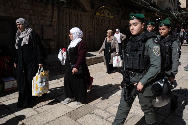 (260220) -- JERUSALEM, Feb. 20, 2026 (Xinhua) -- Palestinians walk toward the Al-Aqsa Mosque compound to attend the first Friday prayers of the holy month of Ramadan in Jerusalem's Old City, Feb. 20, 2026. Israeli authorities tightened security in Jerusalem on the first Friday of Ramadan, capping West Bank worshippers' access to the Al-Aqsa Mosque compound at 10000. (Xinhua/Chen Junqing)