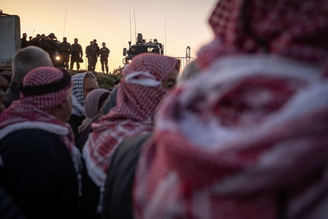 (260220) -- JERUSALEM, Feb. 20, 2026 (Xinhua) -- West Bank residents queue for security checks at the Qalandiya checkpoint, north of Jerusalem, Feb. 20, 2026. Israeli authorities tightened security in Jerusalem on the first Friday of Ramadan, capping West Bank worshippers' access to the Al-Aqsa Mosque compound at 10000. (Xinhua/Chen Junqing)