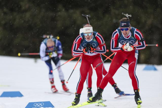 (260220) -- ANTERSELVA, Feb. 20, 2026 (Xinhua) -- Johannes Dale-Skjevdal (C) of Norway competes during the biathlon men's 15km mass start event at the 2026 Milan-Cortina Winter Olympics in Anterselva, Italy, Feb. 20, 2026. (Xinhua/Zhang Tao)