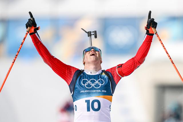 (260220) -- ANTERSELVA, Feb. 20, 2026 (Xinhua) -- Johannes Dale-Skjevdal of Norway celebrates after the biathlon men's 15km mass start event at the 2026 Milan-Cortina Winter Olympics in Anterselva, Italy, Feb. 20, 2026. (Xinhua/Jiang Han)