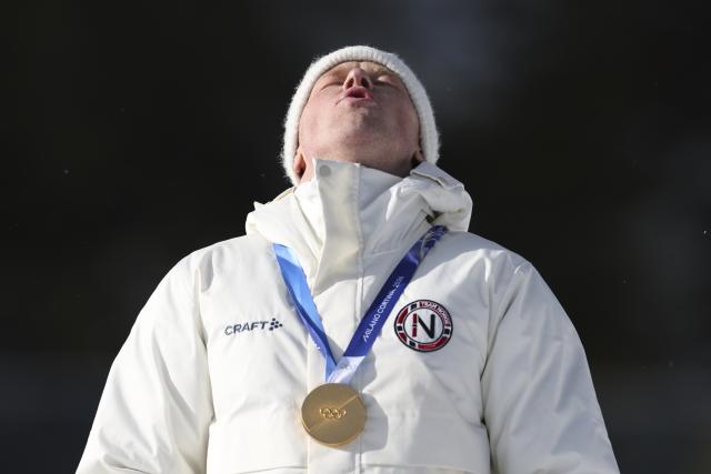 (260220) -- ANTERSELVA, Feb. 20, 2026 (Xinhua) -- Gold medalist Johannes Dale-Skjevdal of Norway reacts during the awarding ceremony of the biathlon men's 15km mass start event at the 2026 Milan-Cortina Winter Olympics in Anterselva, Italy, Feb. 20, 2026. (Xinhua/Zhang Tao)