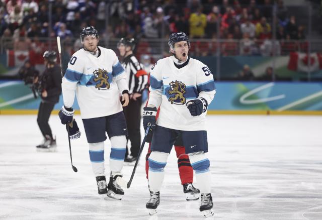 (260220) -- MILAN, Feb. 20, 2026 (Xinhua) -- Erik Haula (front) of Finland celebrates during the ice hockey men's play-offs quarterfinal between Canada and Finland at the Milan-Cortina 2026 Olympic Winter Games in Milan, Italy, Feb. 20, 2026. (Xinhua/Wang Kaiyan)