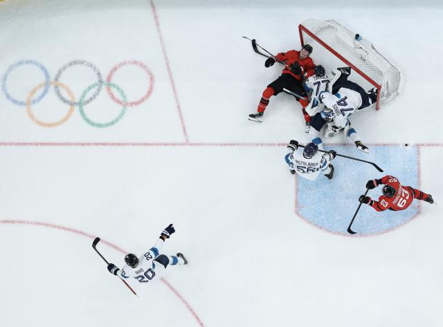 (260220) -- MILAN, Feb. 20, 2026 (Xinhua) -- Players conflict during the ice hockey men's play-offs quarterfinal between Canada and Finland at the Milan-Cortina 2026 Olympic Winter Games in Milan, Italy, Feb. 20, 2026. (Xinhua/Zhang Haofu)