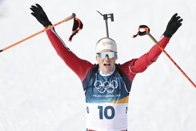 (260220) -- ANTERSELVA, Feb. 20, 2026 (Xinhua) -- Johannes Dale-Skjevdal of Norway celebrates after the biathlon men's 15km mass start event at the 2026 Milan-Cortina Winter Olympics in Anterselva, Italy, Feb. 20, 2026. (Xinhua/Zhang Tao)