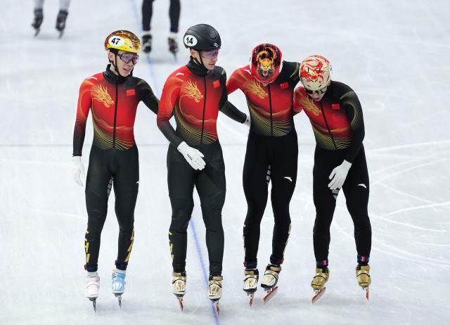 (260220) -- MILAN, Feb. 20, 2026 (Xinhua) -- Zhang Bohao, Liu Shaoang, Sun Long and Lin Xiaojun of China react after the short track speed skating men's 5000m relay final B at the Milan-Cortina 2026 Olympic Winter Games in Milan, Italy, Feb. 20, 2026. (Xinhua/Xue Yuge)
