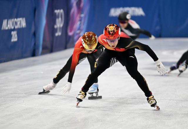 (260220) -- MILAN, Feb. 20, 2026 (Xinhua) -- Sun Long (front) of China competes during the short track speed skating men's 5000m relay final B at the Milan-Cortina 2026 Olympic Winter Games in Milan, Italy, Feb. 20, 2026. (Xinhua/Cheng Min)