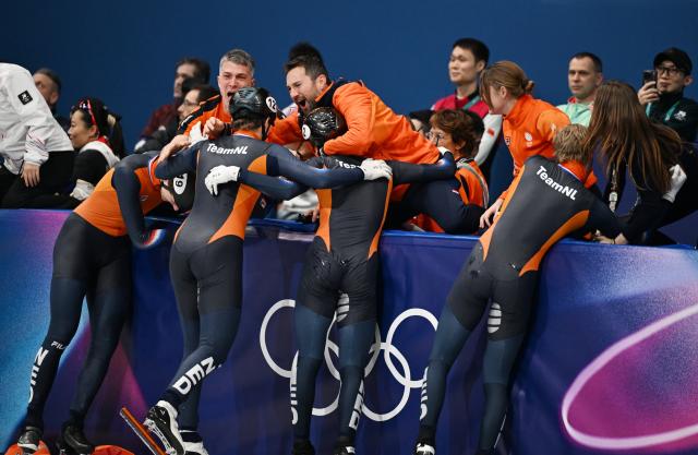 (260220) -- MILAN, Feb. 20, 2026 (Xinhua) -- Members of Team Netherlands celebrate after the short track speed skating men's 5000m relay final A at the Milan-Cortina 2026 Olympic Winter Games in Milan, Italy, Feb. 20, 2026. (Xinhua/Cheng Min)