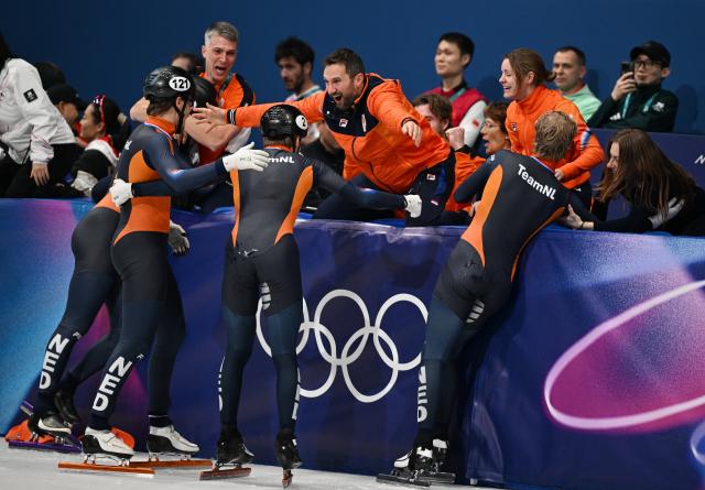 (260220) -- MILAN, Feb. 20, 2026 (Xinhua) -- Members of Team Netherlands celebrate after the short track speed skating men's 5000m relay final A at the Milan-Cortina 2026 Olympic Winter Games in Milan, Italy, Feb. 20, 2026. (Xinhua/Cheng Min)