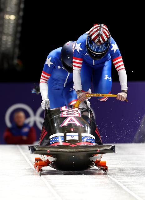(260220) -- CORTINA D'AMPEZZO, Feb. 20, 2026 (Xinhua) -- Kaillie Armbruster Humphries/Jasmine Jones of the United States compete during the Bobsleigh 2-woman heat 1 at the 2026 Milan-Cortina Winter Olympics in Cortina D'Ampezzo, Italy, Feb. 20, 2026. (Xinhua/Ding Xu)