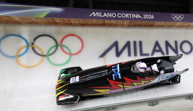 (260220) -- CORTINA D'AMPEZZO, Feb. 20, 2026 (Xinhua) -- Lin Sin-Rong/Lin Song-En of Chinese Taipei compete during the Bobsleigh 2-woman heat 2 at the 2026 Milan-Cortina Winter Olympics in Cortina D'Ampezzo, Italy, Feb. 20, 2026. (Xinhua/Ding Xu)