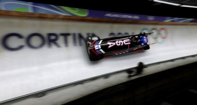 (260220) -- CORTINA D'AMPEZZO, Feb. 20, 2026 (Xinhua) -- Kaysha Love/Azaria Hill of the United States compete during the Bobsleigh 2-woman heat 2 at the 2026 Milan-Cortina Winter Olympics in Cortina D'Ampezzo, Italy, Feb. 20, 2026. (Xinhua/Ding Xu)