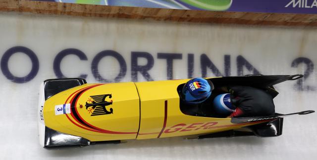 (260220) -- CORTINA D'AMPEZZO, Feb. 20, 2026 (Xinhua) -- Kim Kalicki/Talea Prepens of Germany compete during the Bobsleigh 2-woman heat 2 at the 2026 Milan-Cortina Winter Olympics in Cortina D'Ampezzo, Italy, Feb. 20, 2026. (Xinhua/Ding Xu)