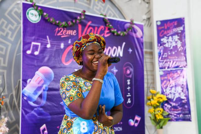 (260220) -- SOA, Feb. 20, 2026 (Xinhua) -- A participant sings a Chinese song in the final of the 12th edition of the "Voice of Cameroon" Chinese song competition at the University of Yaounde II in Soa, Cameroon, Feb. 20, 2026. (Xinhua/Kepseu)