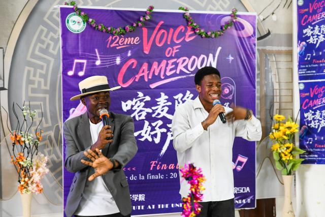 (260220) -- SOA, Feb. 20, 2026 (Xinhua) -- Participants sing a Chinese song in the final of the 12th edition of the "Voice of Cameroon" Chinese song competition at the University of Yaounde II in Soa, Cameroon, Feb. 20, 2026. (Xinhua/Kepseu)