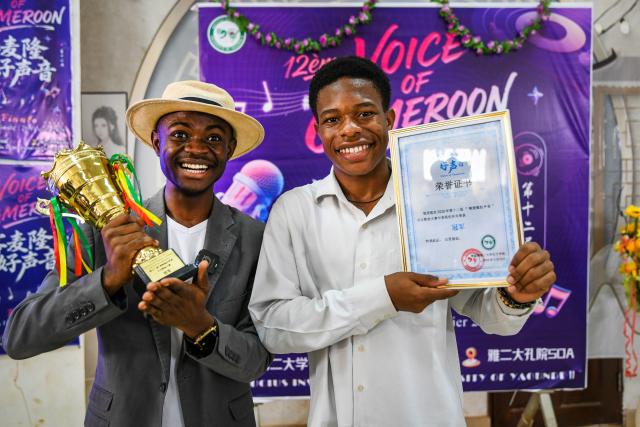 (260220) -- SOA, Feb. 20, 2026 (Xinhua) -- Winners of the 12th edition of the "Voice of Cameroon" Chinese song competition pose with their trophies and certificates at the University of Yaounde II in Soa, Cameroon, Feb. 20, 2026. (Xinhua/Kepseu)