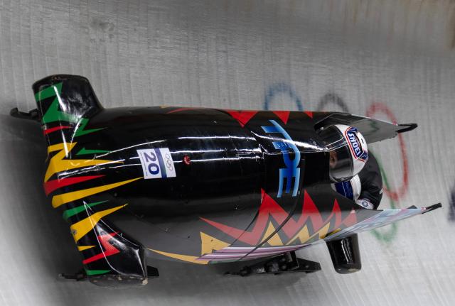 (260220) -- CORTINA D'AMPEZZO, Feb. 20, 2026 (Xinhua) -- Lin Sin-Rong/Lin Song-En of Chinese Taipei compete during the Bobsleigh 2-woman heat 2 at the 2026 Milan-Cortina Winter Olympics in Cortina D'Ampezzo, Italy, Feb. 20, 2026. (Xinhua/Fei Maohua)