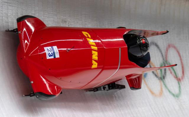 (260220) -- CORTINA D'AMPEZZO, Feb. 20, 2026 (Xinhua) -- Ying Qing/Wang Yu of China compete during the Bobsleigh 2-woman heat 2 at the 2026 Milan-Cortina Winter Olympics in Cortina D'Ampezzo, Italy, Feb. 20, 2026. (Xinhua/Fei Maohua)