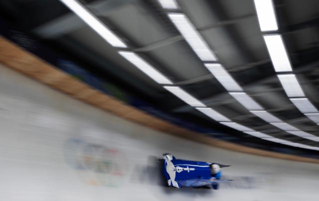(260220) -- CORTINA D'AMPEZZO, Feb. 20, 2026 (Xinhua) -- Giada Andreutti/Alessia Gatti of Italy compete during the Bobsleigh 2-woman heat 1 at the 2026 Milan-Cortina Winter Olympics in Cortina D'Ampezzo, Italy, Feb. 20, 2026. (Xinhua/Fei Maohua)