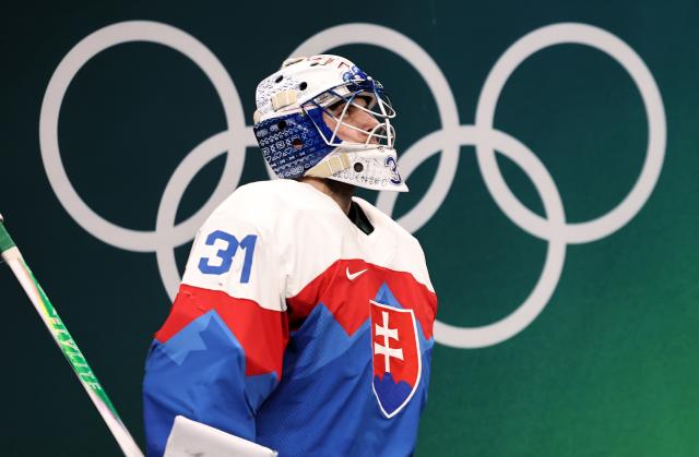 (260221) -- MILAN, Feb. 21, 2026 (Xinhua) -- Samuel Hlavaj, goalkeeper of Slovakia reacts during the ice hockey men's play-offs semifinal match between the United States and Slovakia at the Milan-Cortina 2026 Olympic Winter Games in Milan, Italy, Feb. 20, 2026. (Xinhua/Wang Kaiyan)