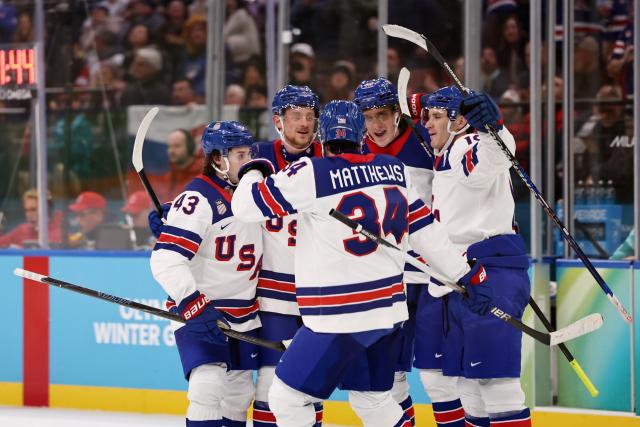 (260221) -- MILAN, Feb. 21, 2026 (Xinhua) -- Players of the United States celebrate a goal during the ice hockey men's play-offs semifinal match between the United States and Slovakia at the Milan-Cortina 2026 Olympic Winter Games in Milan, Italy, Feb. 20, 2026. (Xinhua/Wang Kaiyan)