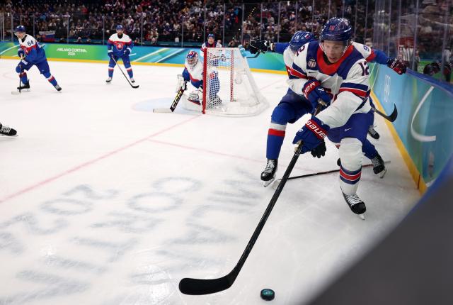 (260221) -- MILAN, Feb. 21, 2026 (Xinhua) -- Matt Boldy (1st R) of the United States competes during the ice hockey men's play-offs semifinal match between the United States and Slovakia at the Milan-Cortina 2026 Olympic Winter Games in Milan, Italy, Feb. 20, 2026. (Xinhua/Wang Kaiyan)