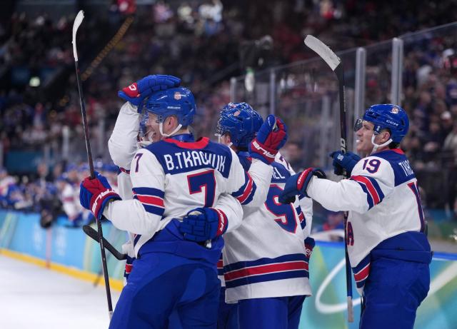 (260221) -- MILAN, Feb. 21, 2026 (Xinhua) -- Players of the United States celebrate Jack Eichel's (C) goal during the ice hockey men's play-offs semifinal match between the United States and Slovakia at the Milan-Cortina 2026 Olympic Winter Games in Milan, Italy, Feb. 20, 2026. (Xinhua/Tao Xiyi)