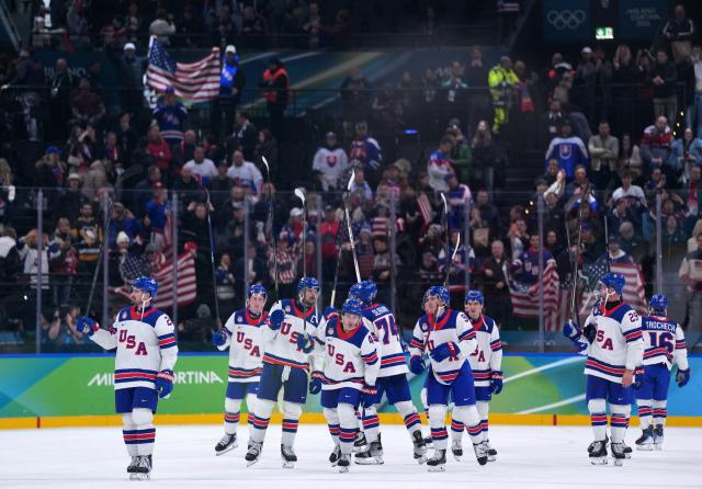 (260221) -- MILAN, Feb. 21, 2026 (Xinhua) -- Players of the United States celebrate victory after winning the ice hockey men's play-offs semifinal match between the United States and Slovakia at the Milan-Cortina 2026 Olympic Winter Games in Milan, Italy, Feb. 20, 2026. (Xinhua/Tao Xiyi)
