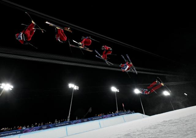 (260221) -- LIVIGNO, Feb. 21, 2026 (Xinhua) -- This multi-exposure photo shows Brendan Mackay of Canada competing during the freestyle skiing men's freeski halfpipe final at the Milan-Cortina 2026 Olympic Winter Games in Livigno, Italy, Feb. 20, 2026. (Xinhua/Xia Yifang)