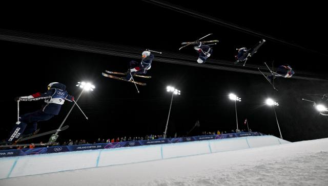 (260221) -- LIVIGNO, Feb. 21, 2026 (Xinhua) -- This multi-exposure photo shows Alex Ferreira of the United States competing during the freestyle skiing men's freeski halfpipe final at the Milan-Cortina 2026 Olympic Winter Games in Livigno, Italy, Feb. 20, 2026. (Xinhua/Xia Yifang)