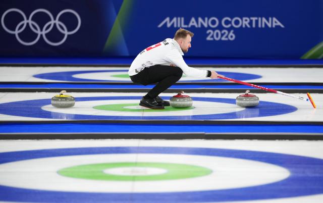 (260221) -- CORTINA D'AMPEZZO, Feb. 21, 2026 (Xinhua) -- Yannick Schwaller of Switzerland competes during the curling men's bronze medal game between Norway and Switzerland at the 2026 Milan-Cortina Winter Olympics in Cortina, Italy, Feb. 20, 2026. (Xinhua/Li Gang)