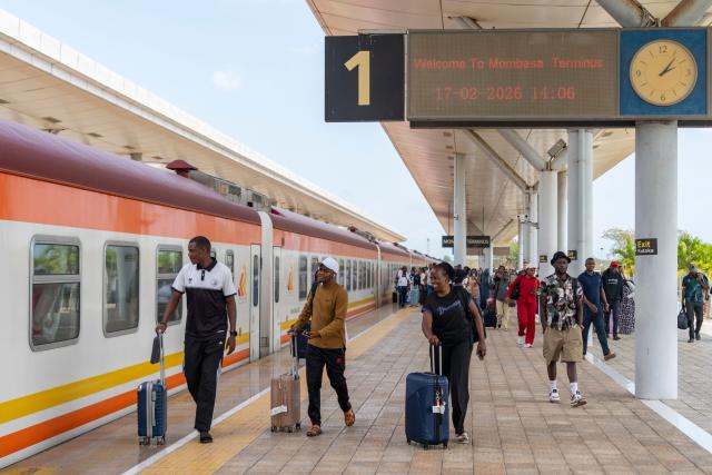 (260221) -- NAIROBI, Feb. 21, 2026 (Xinhua) -- People arrive the Mombasa Terminus of the Mombasa-Nairobi railway in Mombasa, Kenya, Feb. 17, 2026. Stretching 472 km from the port city of Mombasa to the capital Nairobi in Kenya, the Chinese-built Mombasa-Nairobi Standard Gauge Railway (SGR) was launched on May 31, 2017. It is the first new railway built in Kenya since independence and a flagship project of China-Kenya cooperation under the Belt and Road Initiative. (Xinhua/Xie Jianfei)