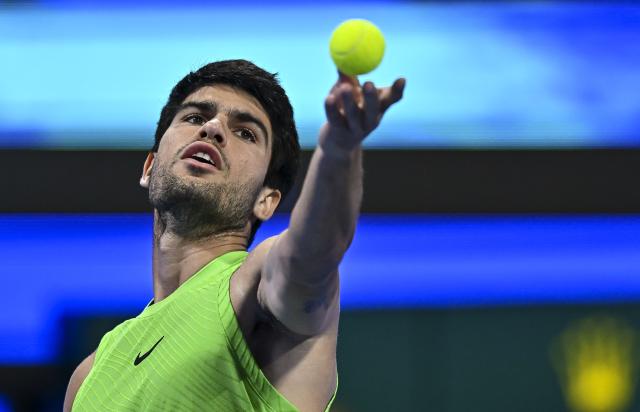 (260221) -- DOHA, Feb. 21, 2026 (Xinhua) -- Carlos Alcaraz serves during the men's singles semi-final match between Carlos Alcaraz of Spain and Andrey Rublev of Russia at the ATP Qatar Open 2026 tennis tournament in Doha, Qatar, on Feb. 20, 2026. (Photo by Nikku/Xinhua)