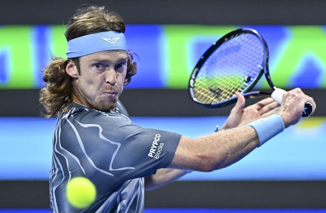 (260221) -- DOHA, Feb. 21, 2026 (Xinhua) -- Andrey Rublev hits a return during the men's singles semi-final match between Carlos Alcaraz of Spain and Andrey Rublev of Russia at the ATP Qatar Open 2026 tennis tournament in Doha, Qatar, on Feb. 20, 2026. (Photo by Nikku/Xinhua)