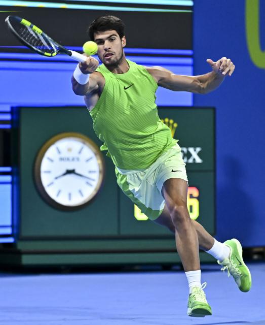 (260221) -- DOHA, Feb. 21, 2026 (Xinhua) -- Carlos Alcaraz hits a return during the men's singles semi-final match between Carlos Alcaraz of Spain and Andrey Rublev of Russia at the ATP Qatar Open 2026 tennis tournament in Doha, Qatar, on Feb. 20, 2026. (Photo by Nikku/Xinhua)