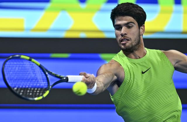 (260221) -- DOHA, Feb. 21, 2026 (Xinhua) -- Carlos Alcaraz hits a return during the men's singles semi-final match between Carlos Alcaraz of Spain and Andrey Rublev of Russia at the ATP Qatar Open 2026 tennis tournament in Doha, Qatar, on Feb. 20, 2026. (Photo by Nikku/Xinhua)
