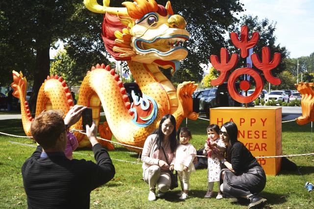 (260221) -- CHRISTCHURCH, Feb. 21, 2026 (Xinhua) -- Visitors pose for photos at an event celebrating the Spring Festival in Christchurch, New Zealand, Feb. 21, 2026. A series of events celebrating the Spring Festival is held here from Feb. 20 to 22. (Photo by Chen Siyumeng/Xinhua)