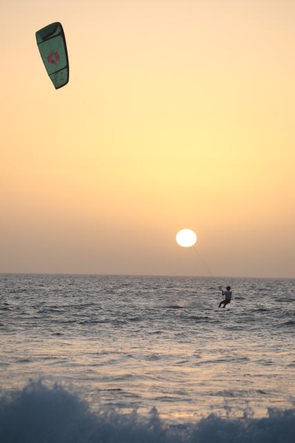 (260221) -- SAL ISLAND, Feb. 21, 2026 (Xinhua) -- A kitesurfer rides on the sea at sunset off Sal Island, Cape Verde, Feb. 20, 2026. (Photo by Elton Monteiro/Xinhua)