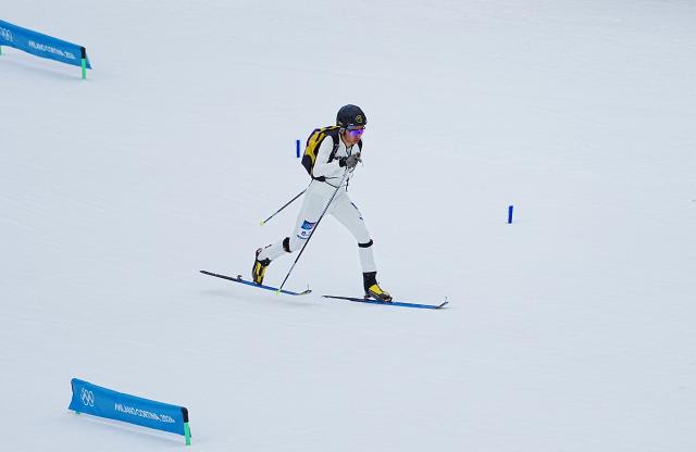 (260221) -- BORMIO, Feb. 21, 2026 (Xinhua) -- Bu Luer of China competes during the ski mountaineering mixed relay event at the Milan-Cortina 2026 Olympic Winter Games in Bormio, Italy, Feb. 21, 2026. (Xinhua/Yan Linyun)