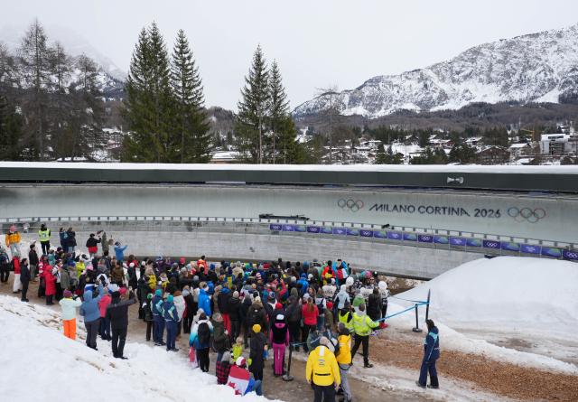 (260221) -- CORTINA D'AMPEZZO, Feb. 21, 2026 (Xinhua) -- The bobsleigh of Trinidad and Tobago is seen crashed during the Bobsleigh 4-man heat 2 at the 2026 Milan-Cortina Winter Olympics in Cortina D'Ampezzo, Italy, Feb. 21, 2026. (Xinhua/Li Gang)