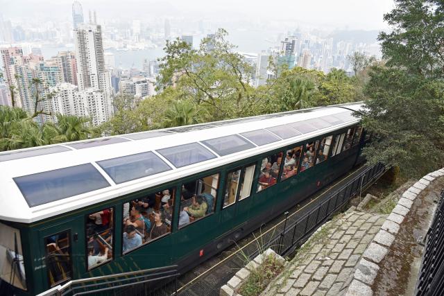 (260221) -- HONG KONG, Feb. 21, 2026 (Xinhua) -- Tourists take a cable car on top of the Victoria Peak, Hong Kong, south China, Feb. 19, 2026. Hong Kong had recorded over 1.16 million visitor arrivals from Feb. 15 to Feb. 20 as many people from the Chinese mainland traveled to the city during the Spring Festival holiday, local data showed on Saturday.
   Among the total, visits from the mainland topped 980,000, data from the Hong Kong Special Administrative Region government showed. Previous estimates put total mainland tourist arrivals during the nine-day holiday at 1.43 million. (Xinhua/Chen Duo)