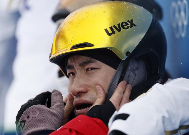 (260221) -- LIVIGNO, Feb. 21, 2026 (Xinhua) -- Li Tianma of China reacts after freestyle skiing mixed team aerials final 2 at the Milan-Cortina 2026 Olympic Winter Games in Livigno, Italy, Feb. 21, 2026. (Xinhua/Wang Peng)