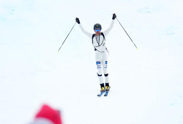 (260221) -- BORMIO, Feb. 21, 2026 (Xinhua) -- Bu Luer of China reacts after finishing the ski mountaineering mixed relay event at the Milan-Cortina 2026 Olympic Winter Games in Bormio, Italy, Feb. 21, 2026. (Xinhua/Hu Huhu)