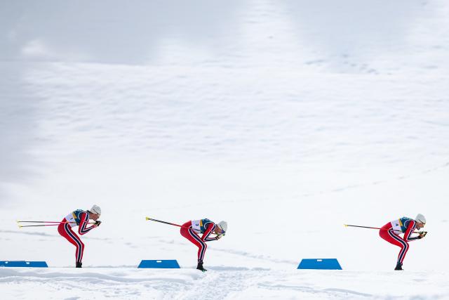 (260221) -- TESERO, Feb. 21, 2026 (Xinhua) -- Johannes Hoesflot Klaebo (L) of Norway and his teammate Emil Iversen of Norway (R) and Martin Loewstroem Nyenget of Norway compete during the cross-country skiing men's 50km mass start classic match at the Milan-Cortina 2026 Olympic Winter Games in Tesero, Italy, Feb. 21, 2026. (Xinhua/Huang Wei)