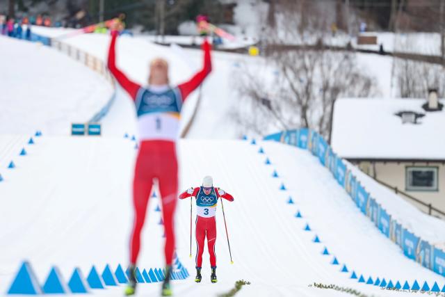 (260221) -- TESERO, Feb. 21, 2026 (Xinhua) -- Martin Loewstroem Nyenget of Norway sprints toward the finish line during the cross-country skiing men's 50km mass start classic match at the Milan-Cortina 2026 Olympic Winter Games in Tesero, Italy, Feb. 21, 2026. (Xinhua/Huang Wei)